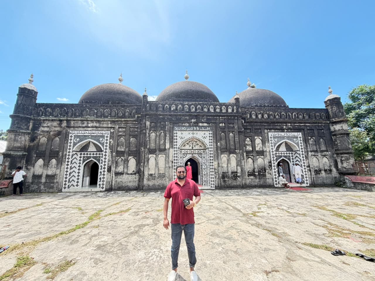 Md. Abu Jubayer standing in front of a historic building