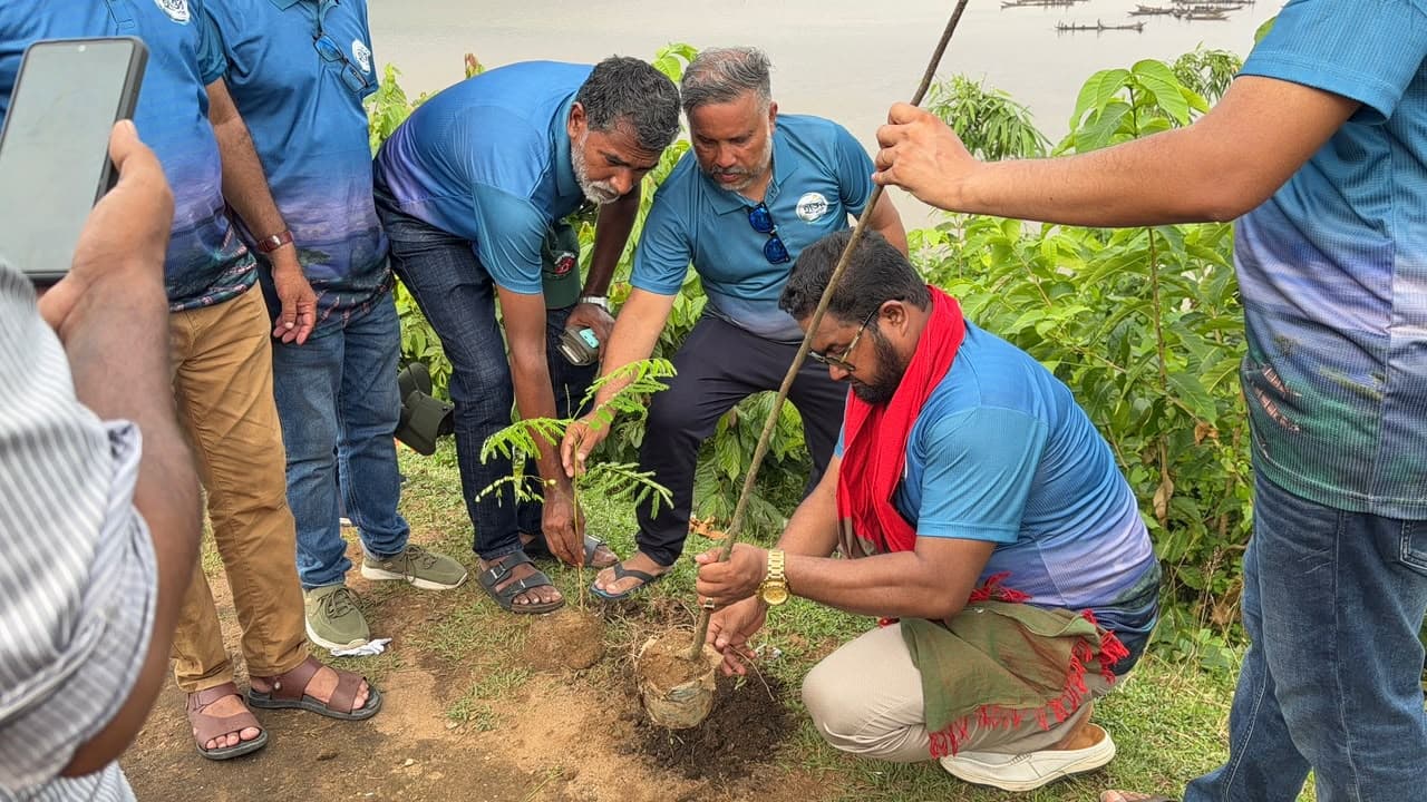 Md. Abu Jubayer and colleagues planting a tree sapling
